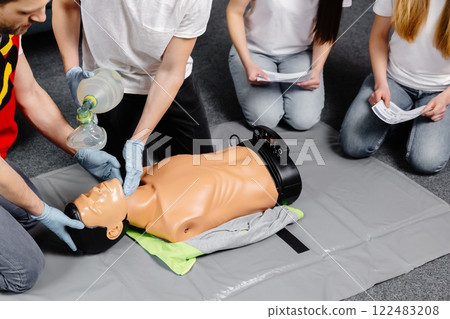 First Aid Training - Cardiopulmonary resuscitation. First aid course on cpr dummy. First Aid Training - Cardiopulmonary resuscitation. First aid course on cpr dummy. 122483208