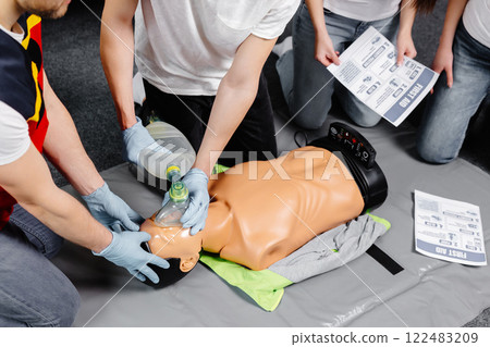 First Aid Training - Cardiopulmonary resuscitation. First aid course on cpr dummy. First Aid Training - Cardiopulmonary resuscitation. First aid course on cpr dummy. 122483209