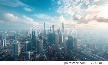 Breathtaking aerial shot of a modern cityscape bathed in the warm glow of sunrise Breathtaking aerial shot of a modern cityscape bathed in the warm glow of sunrise 122483839
