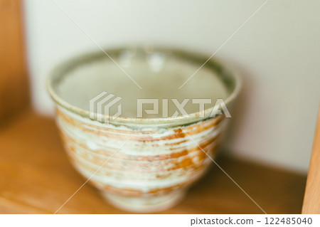 Close up handmade bowl ceramic on shelves Close up handmade bowl ceramic on shelves 122485040