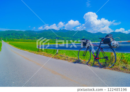 Cycling along the rice fields Cycling along the rice fields 122485196