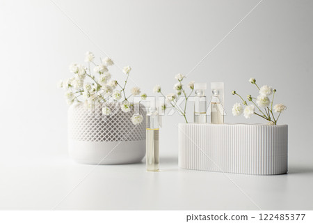 A small sample bottle of parfume 122485377