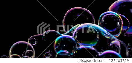 Colorful soap bubbles on black background, transparent spheres with iridescent reflections, ideal for overlays, photo editing, creative designs, various sizes, transparent spheres Colorful soap bubbles on black background, transparent spheres with iridescent reflections, ideal for overlays, photo editing, creative designs, various sizes, transparent spheres 122485739