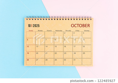 October 2025 craft brown paper calendar on pink and blue background. October 2025 craft brown paper calendar on pink and blue background. 122485927
