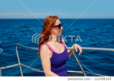 Beautiful woman girl in a boat relaxed profile Beautiful woman girl in a boat relaxed profile 122486104
