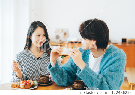 A young couple having a meal A young couple having a meal 122486232