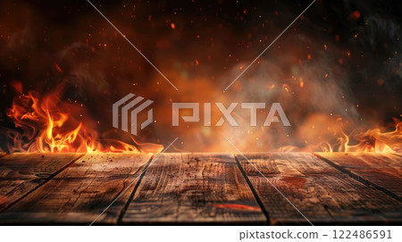 A wood burning fire with smoke and ash in the background 122486591