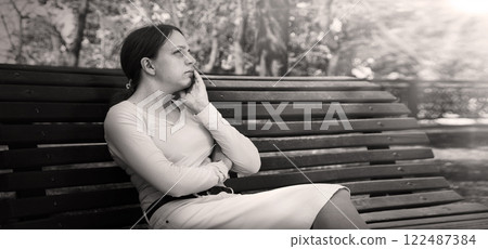 Sad girl praying to God 122487384