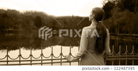 Sad girl praying to God Sad girl praying to God 122487395