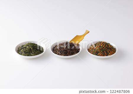 Green tea, roasted green tea and brown rice tea leaves on a plate Green tea, roasted green tea and brown rice tea leaves on a plate 122487806