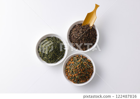 Green tea, roasted green tea and brown rice tea leaves on a plate Green tea, roasted green tea and brown rice tea leaves on a plate 122487816