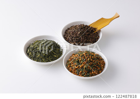 Green tea, roasted green tea and brown rice tea leaves on a plate Green tea, roasted green tea and brown rice tea leaves on a plate 122487818