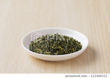Green tea leaves on a plate 122488352