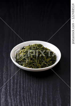 Green tea leaves on a plate Green tea leaves on a plate 122488514