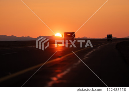 Golden Sunset Over Desert Highway Scenic Road Trip Adventure. Saudi Arabia.  122488558