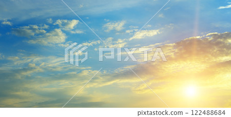 Cloudy sky and bright sunrise over the horizon. 122488684