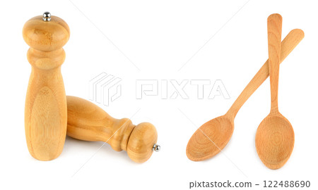 Pepper grinder mills and Wooden spoons isolated on white. Free space for text. Wide photo. Collage. 122488690