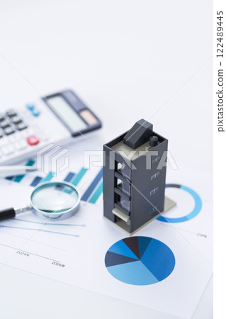 Blue graph, company building, calculator and magnifying glass 122489445