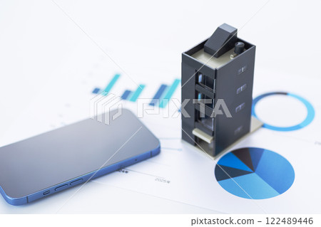 Blue graph, company building and smartphone 122489446