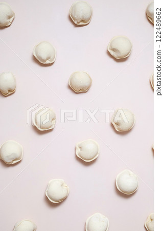 Pattern of raw dumplings. Frozen food. Pattern of raw dumplings. Frozen food. 122489662
