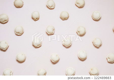 Pattern of raw dumplings. Frozen food. Pattern of raw dumplings. Frozen food. 122489663