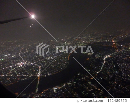Night flight over the Straits of Johor, Singapore 122489853
