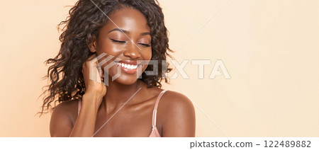 Portraits of smiling Black women with natural hairstyles, showcasing confidence and beauty 122489882