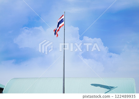 The Thai flagpole has a sky background. 122489935