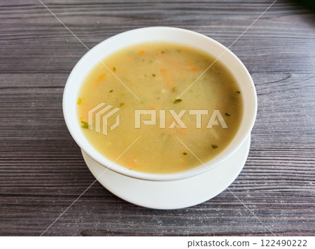 White bowl with Krupnik Polish soup. 122490222