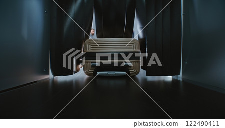 Security Checkpoint in Airport: Close Up of Suitcase Moving on Conveyor Belt Inside Advanced X-ray Scanner 122490411