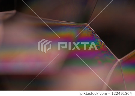 Green rainbow reflection of liquid in macro, white colors, surrealistic background, fantastic smooth movement, water surface, spectrum texture 122491564