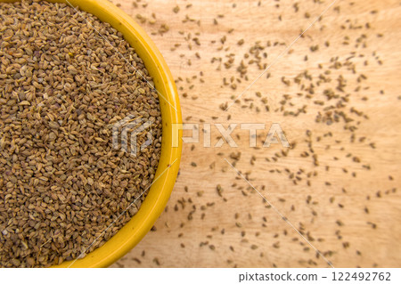 Top View of Ajwain, Carom Seeds, Thymol Seeds, Bishop's Weed in a Yellow Bowl, Closeup Top View of Ajwain, Carom Seeds, Thymol Seeds, Bishop's Weed in a Yellow Bowl, Closeup 122492762