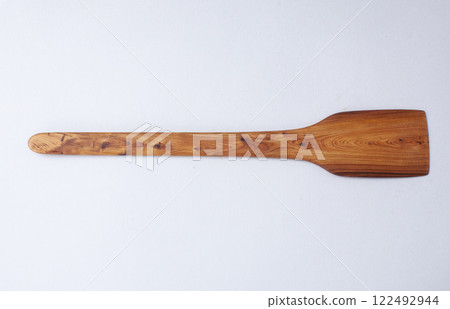 Wooden kitchen utensils stacked view, spoon and spatula close up Wooden kitchen utensils stacked view, spoon and spatula close up 122492944