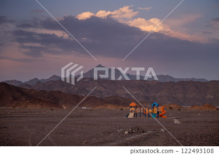 Playground in a Barren Desert Surreal Landscape at Dusk Playground in a Barren Desert Surreal Landscape at Dusk 122493108