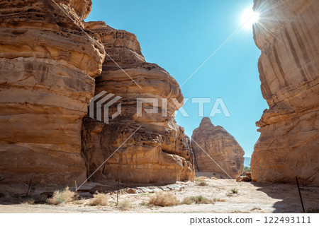 Majestic Sandstone Canyons of AlUla Sunlit Desert Passage in Saudi Arabia Majestic Sandstone Canyons of AlUla Sunlit Desert Passage in Saudi Arabia 122493111