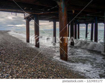 Metal pier on columns. Construction on the sea.Rusty pier. 122493177