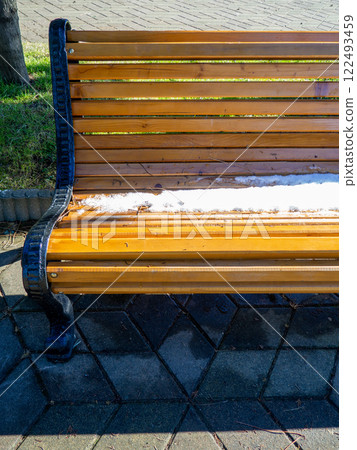 Snow on a park bench. Winter in Batumi. Winter at the resort. Southern City . Sudden snowfall. 122493459