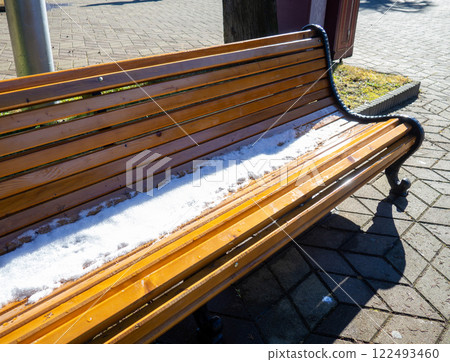 Snow on a park bench. Winter in Batumi. Winter at the resort. Southern City . Sudden snowfall. Snow on a park bench. Winter in Batumi. Winter at the resort. Southern City . Sudden snowfall. 122493460