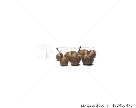 Allspice on a white background. Peppercorn isolate. Seasoning for dishes. Cooking. Allspice on a white background. Peppercorn isolate. Seasoning for dishes. Cooking. 122493476