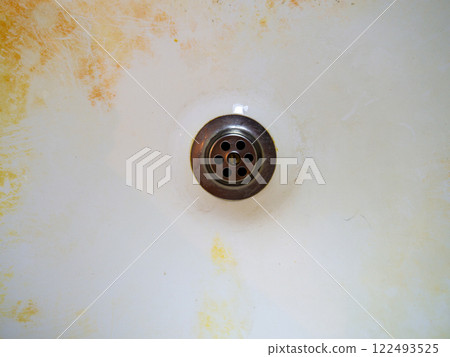Mold on bathroom enamel. Black dots of mold and yellow plaque. Requires cleaning. Before using cleaning products. Mold on bathroom enamel. Black dots of mold and yellow plaque. Requires cleaning. Before using cleaning products. 122493525