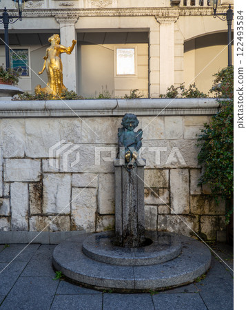 Angel in the square A pedestal with a water tap. Landmark in Batumi. A monument that is rubbed by hand. Angel in the square A pedestal with a water tap. Landmark in Batumi. A monument that is rubbed by hand. 122493584