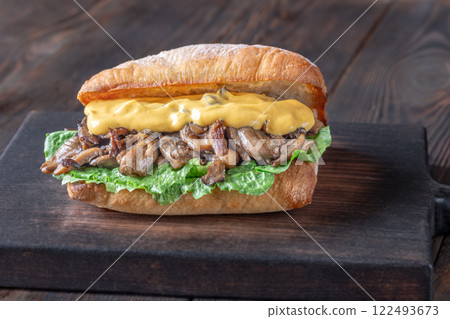 Delicious vegetarian sandwich with toasted ciabatta, fried oyster mushrooms, and yellow sauce 122493673