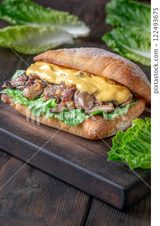 Delicious vegetarian sandwich with toasted ciabatta, fried oyster mushrooms, and yellow sauce 122493675