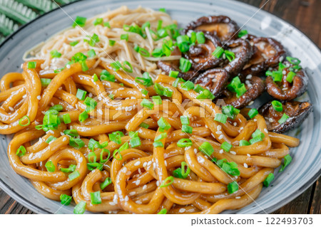Udon Noodles with Soy Unagi Sauce, Mushrooms, and Green Onion 122493703