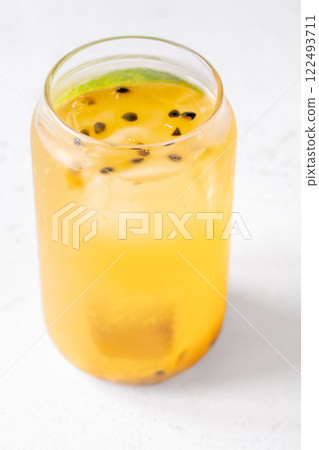 Waltzing Matilda cocktail with passion fruit, gin, and ginger ale in jar glass Waltzing Matilda cocktail with passion fruit, gin, and ginger ale in jar glass 122493711