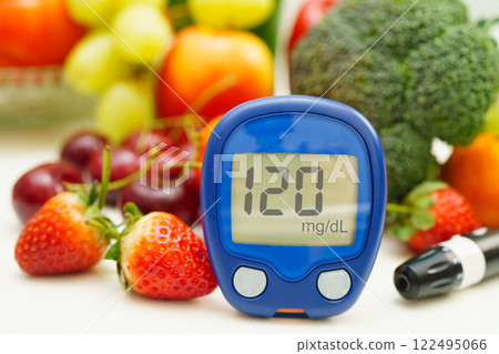 Digital glucose meter food for check sample blood sugar level to treatment diabetes with vegetable and fruit healthy. Digital glucose meter food for check sample blood sugar level to treatment diabetes with vegetable and fruit healthy. 122495066