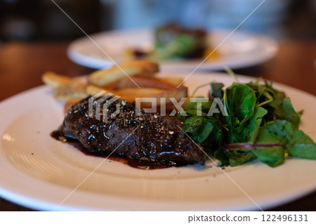 cut beef steak medium beef steak cooked medium well cut sliced knife 122496131