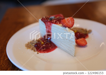 thin cakes with cream white cake thin cakes many layers with strawberry jam eat with a spoon from a white plate thin pancakes smeared with cream for breakfast thin cakes with cream white cake thin cakes many layers with strawberry jam eat with a spoon from a white plate thin pancakes smeared with cream for breakfast 122496153