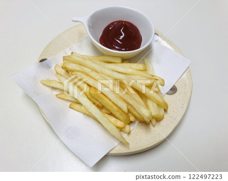 French fries with ketchup 122497223