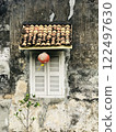 Beautiful rustic Sino-Portuguese architecture background at shophouse building with vintage window and red lantern 122497630